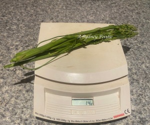asparagus spears on a kitchen scale