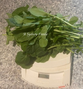 landcress leaves on a kitchen scale